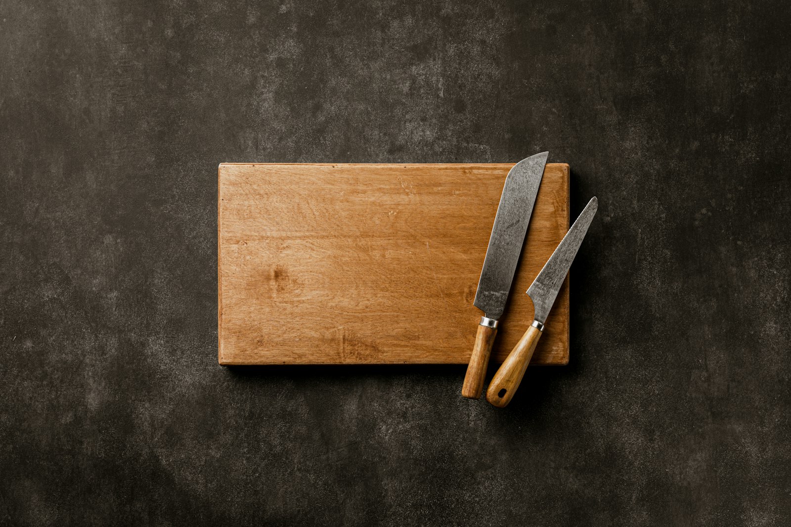 Wooden cutting boards arranged on a kitchen surface